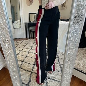 Black Zara trousers with a red and white stripe down each leg. Gold buttons.